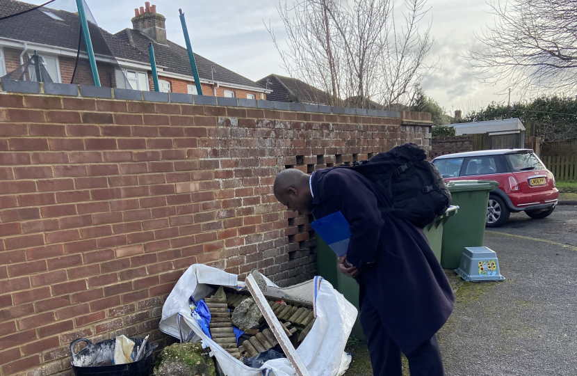 Sidney Yankson inspecting neglected bins in Peartree