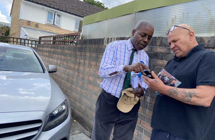 Sidney Yankson listening to residents about poor pavements which are trip hazards for residents