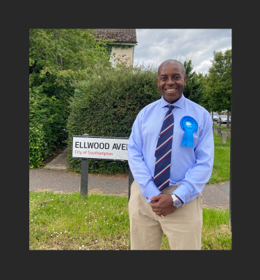 Sidney Yankson listening to residents in Thornhill discussing poor council services