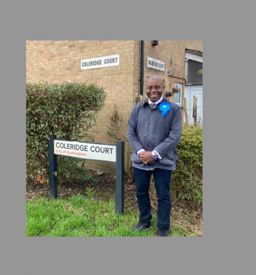 Sidney Yankson listening to residents in the poets.