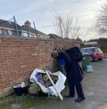 Sidney Yankson inspecting neglected bins in Peartree