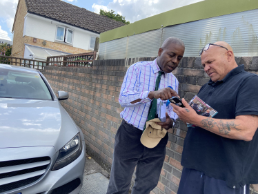 Sidney Yankson listening to residents about poor pavements which are trip hazards for residents